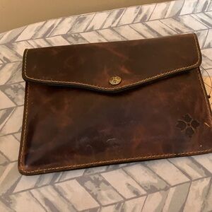 Brown leather clutch bag